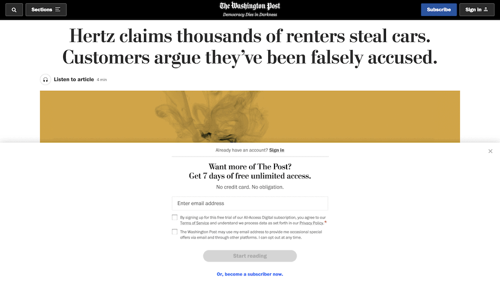 The Washington Post website, showing a paywall in place offering a free trial of content.